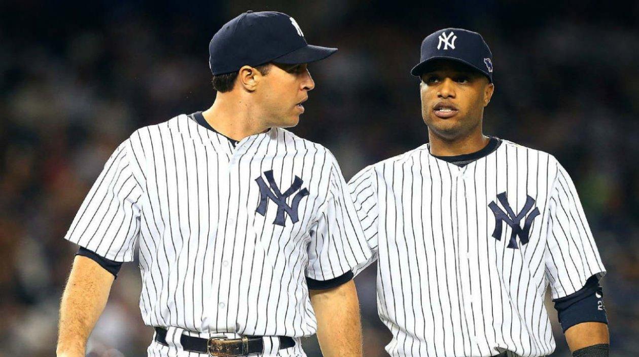 Mark Teixeira y Robison Canó en sus épocas como jugadores de los Yankees. 