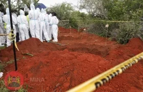 Se han identificado más tumbas, pero se cavarán después de que se complete la autopsia de 129 cuerpos.